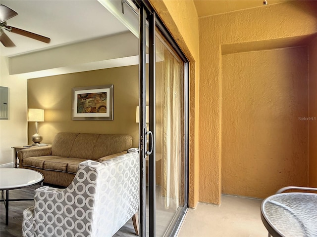 living room featuring carpet floors and ceiling fan