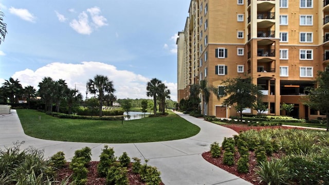 view of property's community featuring a yard