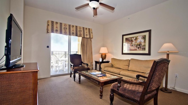 living room with dark carpet and ceiling fan