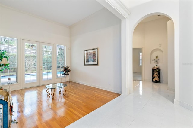 interior space featuring french doors and light tile flooring