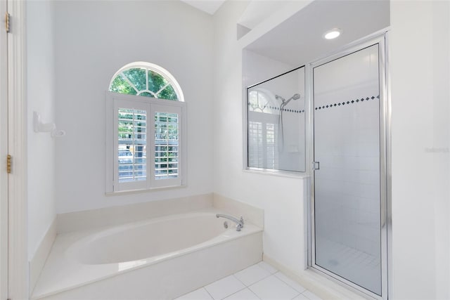 bathroom featuring tile flooring and independent shower and bath