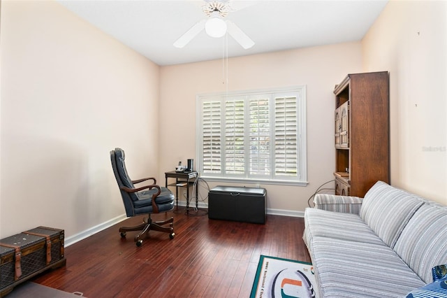 sitting room featuring ceiling fan and dark hardwood / wood-style flooring