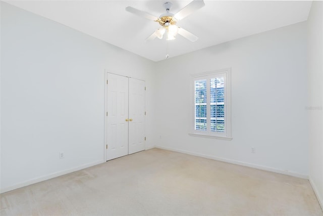 unfurnished room featuring carpet floors and ceiling fan