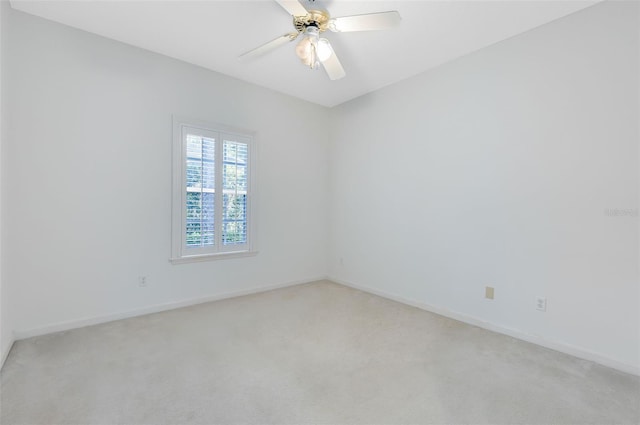 unfurnished room featuring carpet and ceiling fan