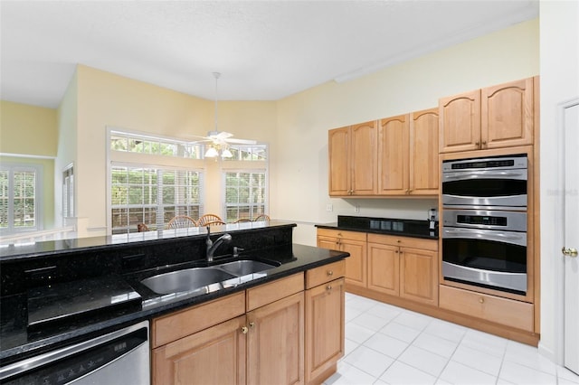 kitchen with light brown cabinets, dishwashing machine, light tile floors, sink, and stainless steel double oven