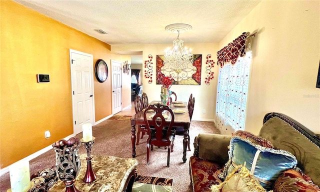 dining room featuring a textured ceiling, a notable chandelier, and carpet