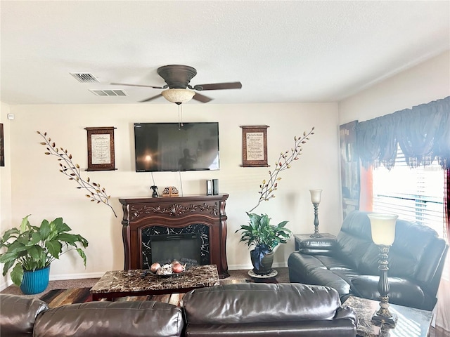 living room with hardwood / wood-style flooring and ceiling fan