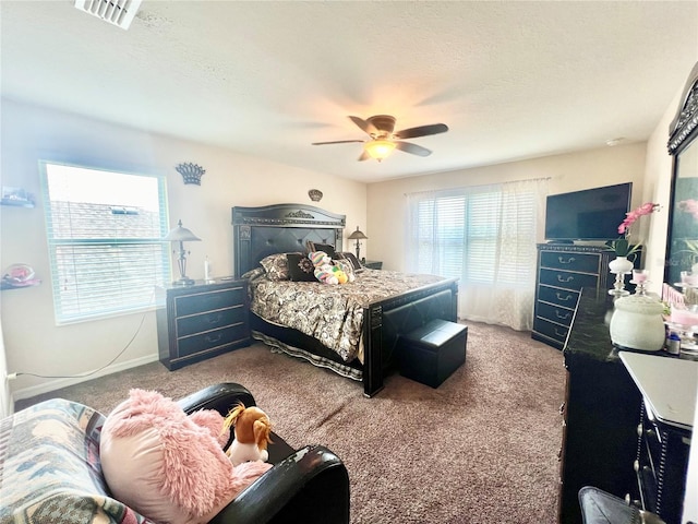 bedroom with ceiling fan and carpet floors