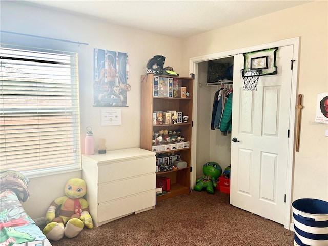 carpeted bedroom featuring a closet