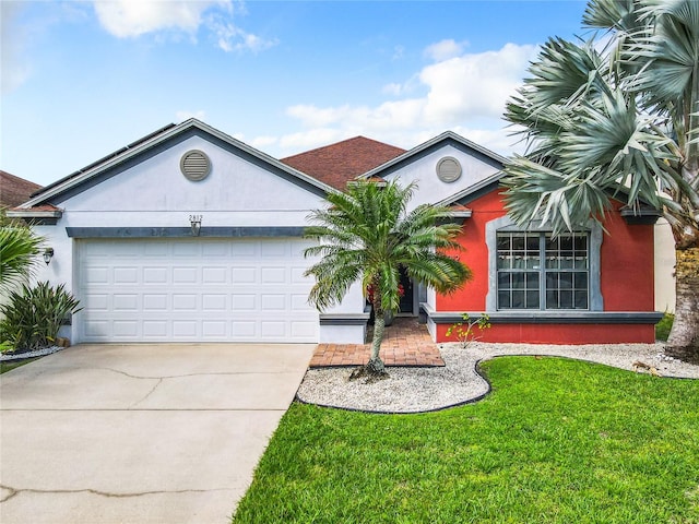 single story home featuring a front yard and a garage