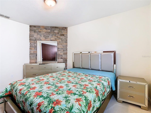 bedroom featuring light carpet