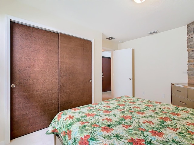 carpeted bedroom featuring a closet