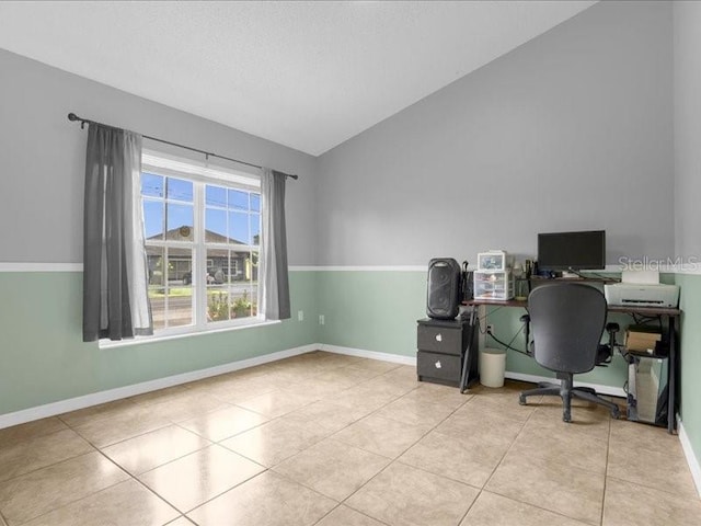 tiled home office with lofted ceiling