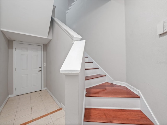 staircase with tile patterned flooring