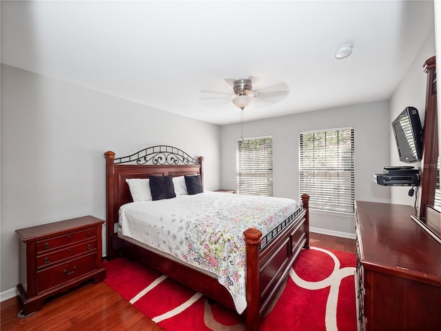 bedroom featuring dark hardwood / wood-style flooring and ceiling fan