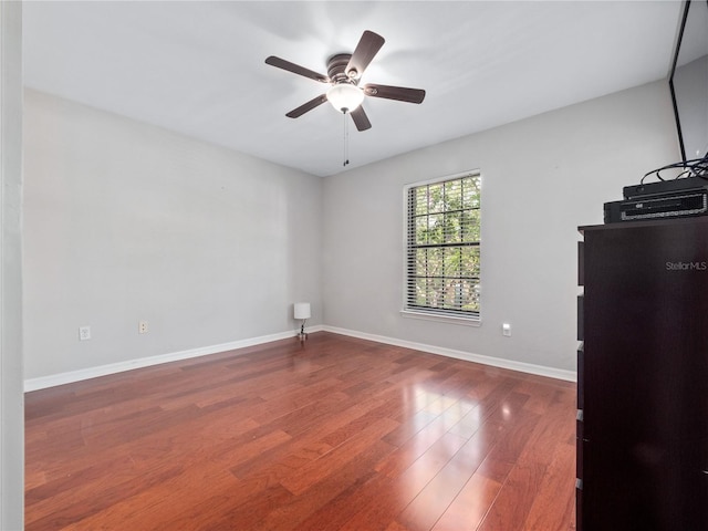 unfurnished room with hardwood / wood-style flooring and ceiling fan