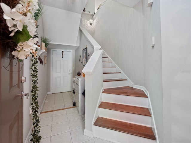 staircase with tile patterned flooring