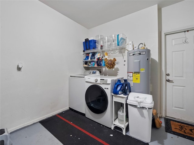 laundry area with electric water heater and washing machine and dryer