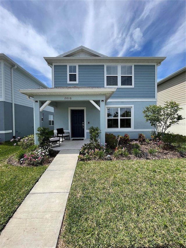 front facade featuring a front lawn