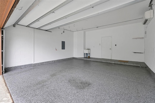 garage with sink, a wall mounted air conditioner, and electric panel