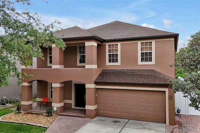 view of front of property with a garage