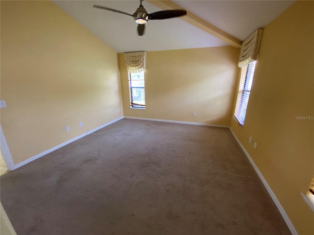 carpeted spare room with ceiling fan and lofted ceiling with beams