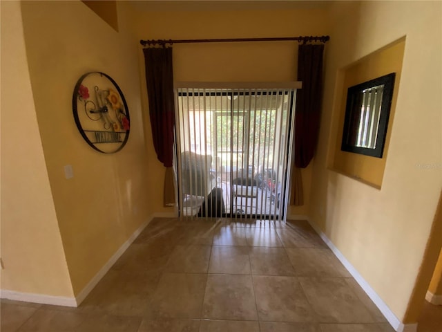 unfurnished room featuring light tile patterned flooring