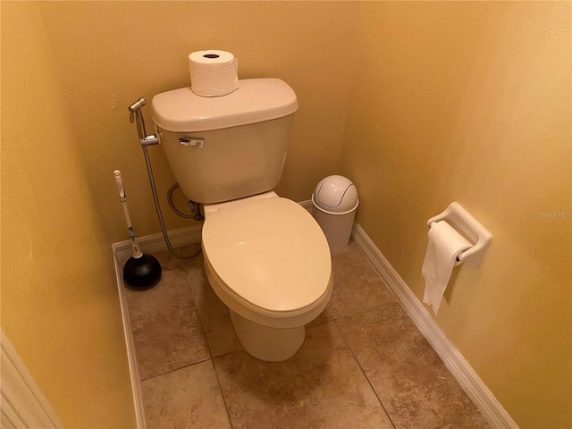 bathroom featuring tile patterned floors and toilet