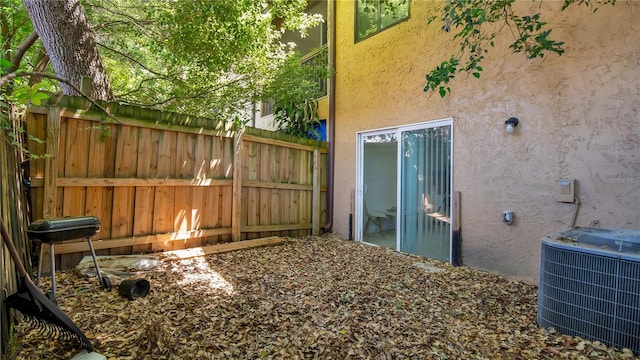 view of yard with central air condition unit