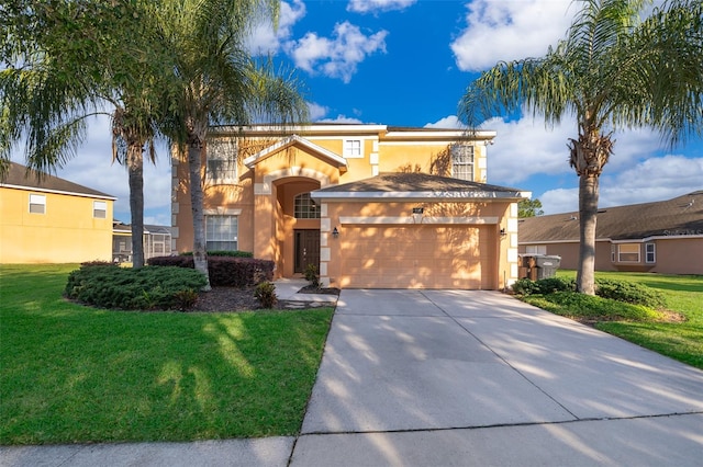 mediterranean / spanish-style house with a garage and a front yard