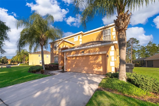 view of front of home featuring a garage and a front lawn