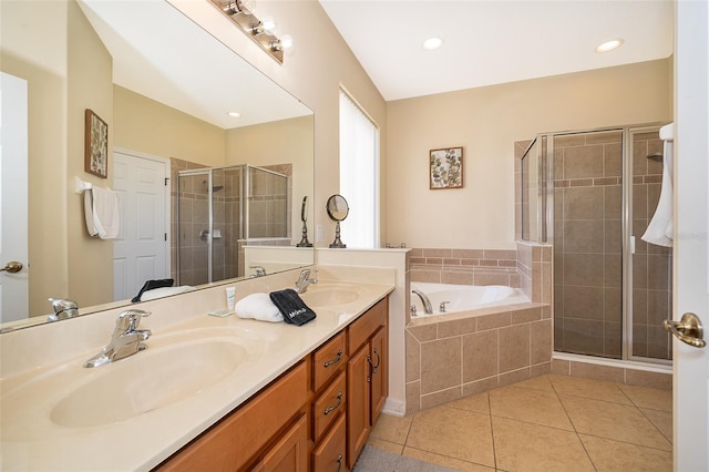 bathroom featuring double sink, large vanity, tile flooring, and plus walk in shower