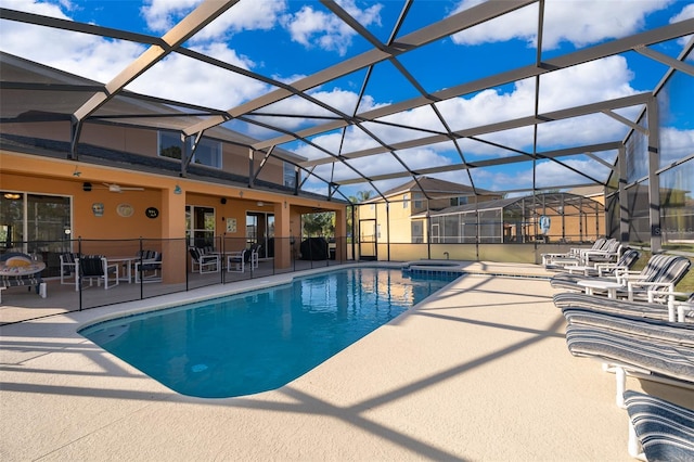 view of pool featuring a lanai and a patio