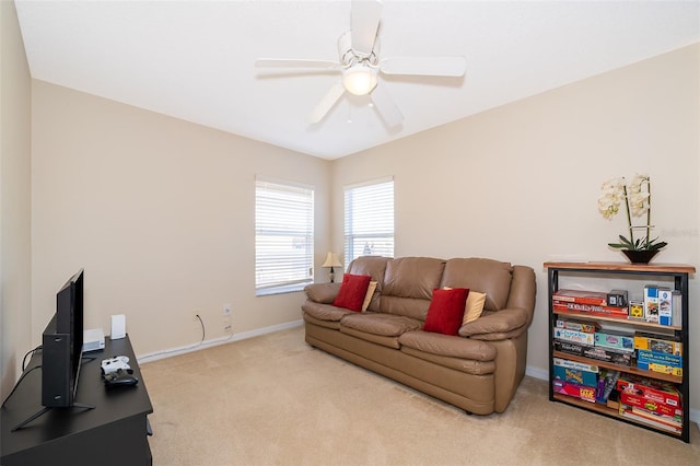 carpeted living room featuring ceiling fan