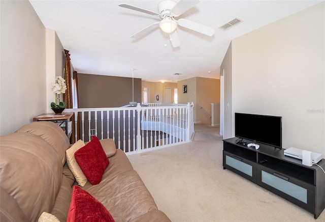 carpeted living room featuring ceiling fan