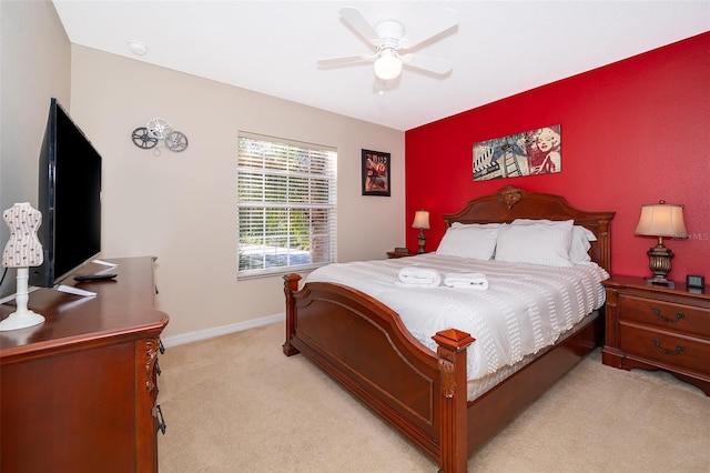 bedroom with light colored carpet and ceiling fan