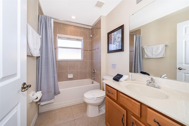 full bathroom with tile floors, toilet, oversized vanity, and shower / bath combo with shower curtain