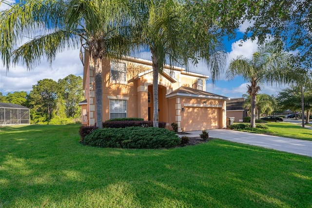 mediterranean / spanish-style house with a garage and a front lawn