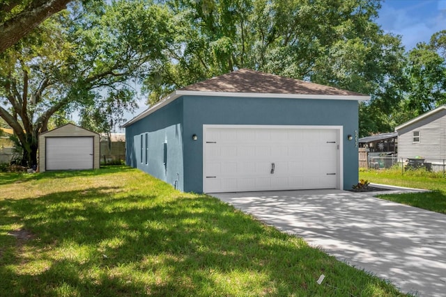 garage with a yard