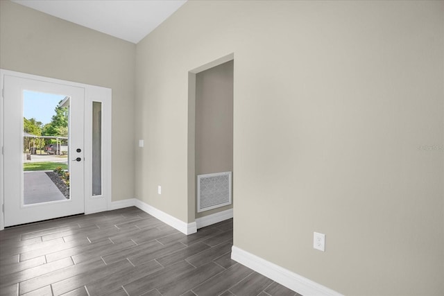 foyer entrance featuring dark hardwood / wood-style floors