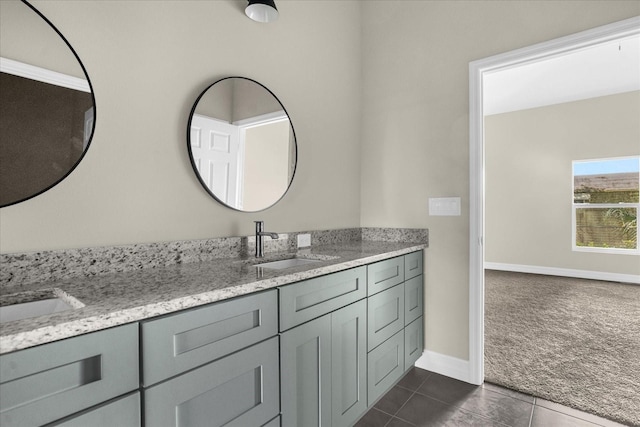 bathroom featuring tile floors and double sink vanity