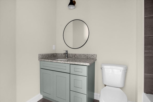 bathroom with toilet and vanity