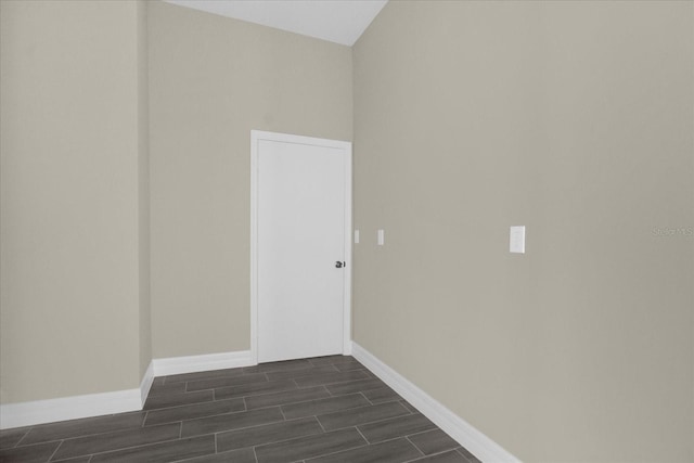 clothes washing area featuring dark hardwood / wood-style flooring