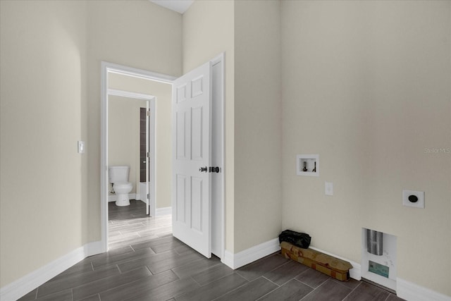 laundry room featuring electric dryer hookup, washer hookup, and dark wood-type flooring