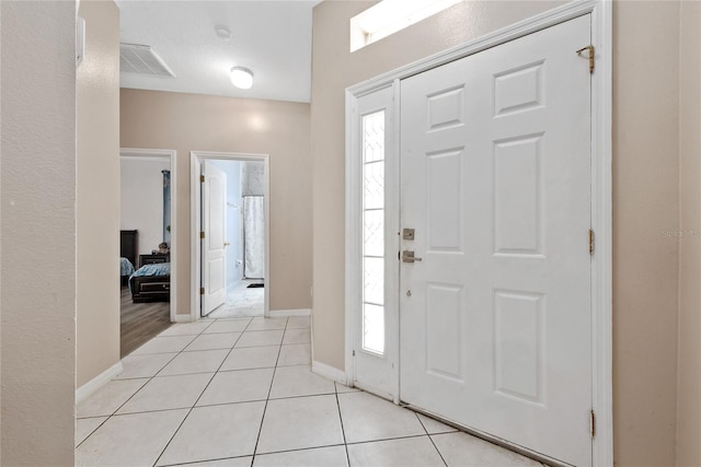 view of tiled foyer entrance