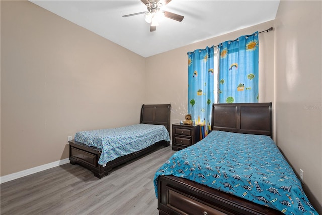 bedroom featuring ceiling fan and light hardwood / wood-style flooring