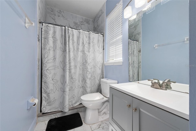 bathroom featuring tile patterned floors, toilet, and vanity