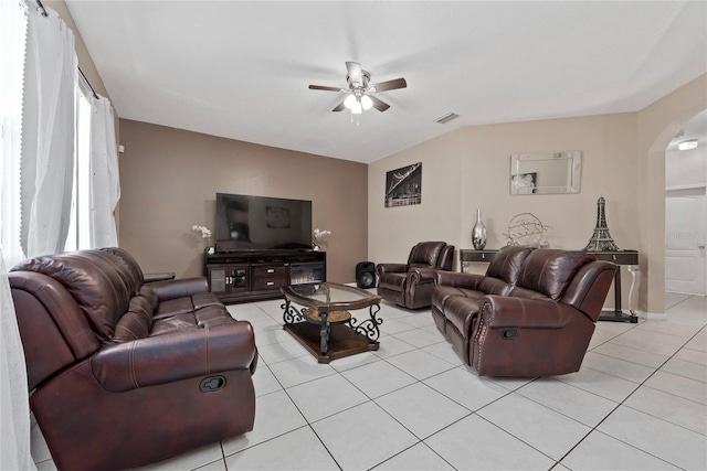 tiled living room featuring ceiling fan