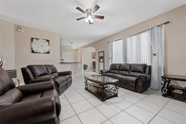 living room featuring light tile patterned floors and ceiling fan