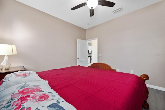 bedroom with hardwood / wood-style flooring and ceiling fan